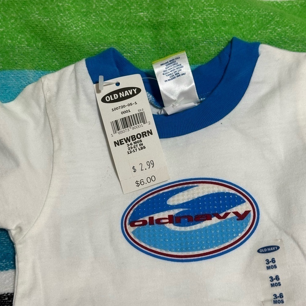 Old Navy onesie. White with blue trim & decal. Size 3-6 months. New with tags